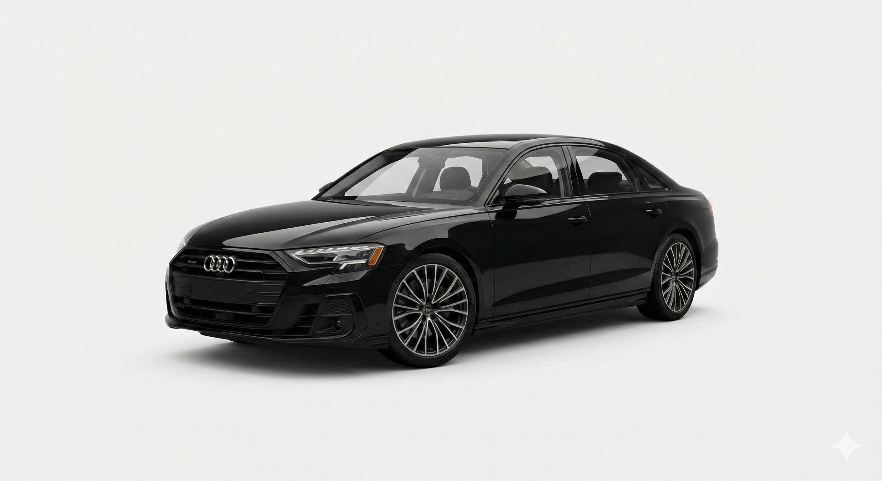 Front view of a sleek, black Audi A8 against a bright, white background, highlighting its luxury design. The license plate is not visible.